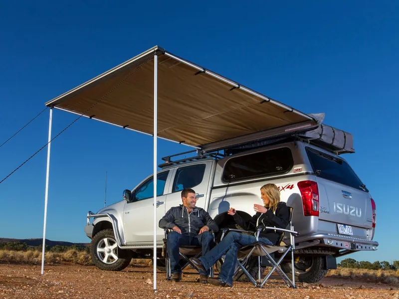 ARB 2000 side-pull vehicle awning in tan ripstop fabric with PVC storage bag